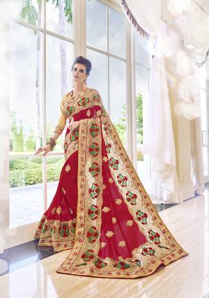 Drape This Red And Golden Colored Saree And Look Pretty Like Never Before. This Beautiful Saree Features Georgette And Heavy Worke  Border , Which Makes It A Smart Pick For Festive Occasions.This Saree Attains A Spotting Personality Through Its Amazing Design And Color Combination. Grab It Now.