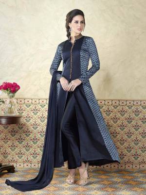 Being Beautiful And Looking Beautiful Are Two Different Things, We Have For You These lovely Suits That Will Definitely Make You Look Beautiful. This Lovely Navy Blue Colored Suit Is Fabricated In Satin And Paired With A Navy Blue Color Santoon Bottom. Its  Navy Blue Colored Chiffon Dupatta Adds Grace To The Combination. Wear It And Shine.