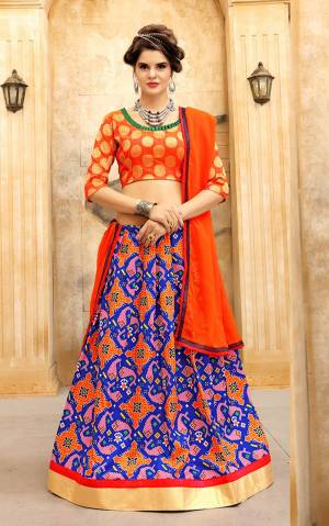 Orange Color Induces Perfect Summery Appeal To Any Outfit. Grab This Simple Lehenga Choli In Orange Colored Blouse Paired With Blue And Orange Lehenga And Orange Colored Dupatta. Its Lehenga And Choli Are Fabricated On Art Silk Paired With Georgette Fabricated Dupatta.