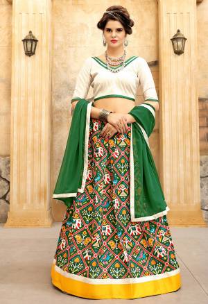 Simple And Elegant Looking Lehenga Choli Is Here With This White Colored Blouse Paired With Green Colored Lehenga And Dupatta. Its Lehenga And Choli are Fabricated On Art Silk Paired With Georgette Fabricated Dupatta. It Has Beautiful Folk Prints All Over The Lehenga. Buy This Now.