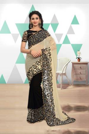 Enhance Your Beauty Wearing This Saree In Cream And Black Color Paired With Black Colored Blouse. This Saree Is Fabricated On Georgette Paired With Art Silk And Net Fabricated Blouse.  It Is Beautified With Elegant Thread Embroidery Over The Lace Border. Buy This Designer Saree Now.