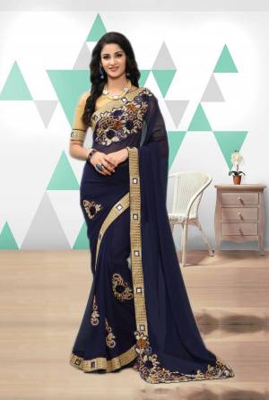 Grab This Pretty Saree In Navy Blue Color Paired With Beige Colored Blouse. This Saree Is Fabricated On Georgette Paired With Art Silk Fabricated Blouse. This Saree Is Fabricated On Georgette Paired With Art Silk Fabricated Blouse. 