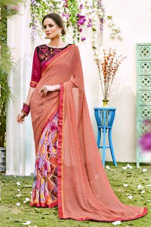 Look Pretty Wearing This Saree In Peach Color Paired With Contrasting Magenta Pink Colored Blouse. This Saree Is Fabricated On Georgette Beautified With Prints Paired With Art Silk Fabricated Blouse Beautified With Embroidery.