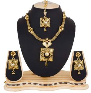 Even With Your Simple Traditonal You Can Pair Up This Beautiful Necklace Set Which Is In Golden Color. This Set Can Be Paired With Any Kind Of Attire In Any Color.