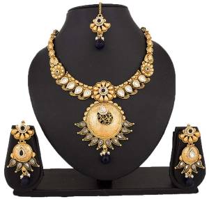 Here Is A Beautiful Necklace To Pair Up With Your Navy Blue Colored Dress. This Lovely Necklace Set Is In Golden Color Beautified With Navy Blue Colored Stones. You Can Also Pair It Up With Any Contrasting Colored Attire.
