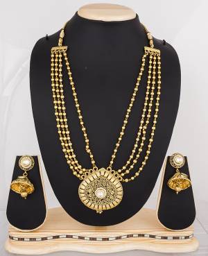 Here Is A Layered Chain Necklace Set In Golden Color Beautified With Pearl Work. This Necklace Set Be Paired With Any Heavy Or Light Attire. Buy This Multi Purpose Necklace Set Now.