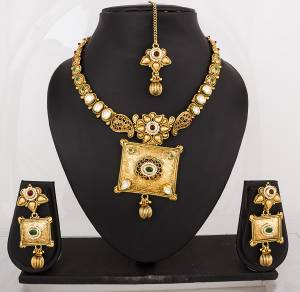 Grab This Traditional Beautiful Necklace Set On golden Color Beautified With Stone Work. Pair This Up With a Banarasi Saree To complete A Traditonal Look. Buy This Necklace Set Net.