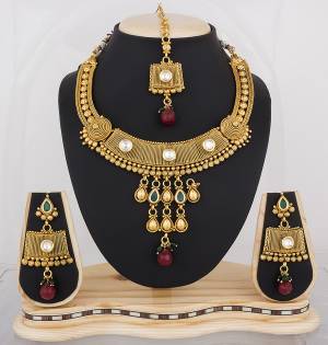 Feel Like A Quen With This Beautiful Necklace Set In Golden Color Beautified With Multi Colored Stones. This Necklace Set Is Light In Weight And Easy To Carry All Day Long.
