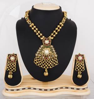 To Give A Heavy Traditonal Look Get This Amazing Necklace Set In Golden Color Beautified With Multi Colored Stones And Kundan Work. Buy This Soon Before The Stock Ends.