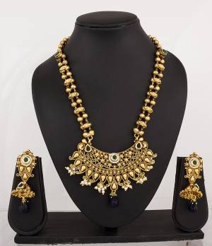 For A Trendy Loo, Grab This Amazing Necklace set In Golden Color Beautifed With Navy Blue Colored Stones. This Can Be Paired With Any Contrasting Colored Attire Os Navy Blue Colored Attire. Buy It Now.