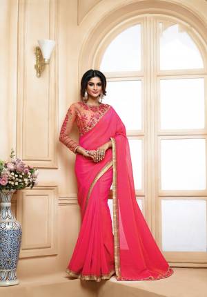 Grab This Amazing Designer Saree For The Next Party In Lovely Pink Color Paiured With Contrasting Peach Colored Blouse. This Saree Is Fabricated On Georgette Paired With Art Silk And Net Fabricated Blouse. It Has Heavy Embroidered Blouse And Saree Lace Border. Buy It Now.