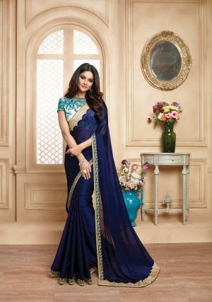 Enhance Your Personality Wearing This Designer Saree In Navy Blue Color Paired With Off-White Colored Blouse. This Lovely Saree Is Fabricated On Satin Georgette Paired With Art Silk And Net Fabricated Blouse. It Has Attractive Lace Border And Heavy Embroidery Over The Blouse. Buy This Saree Now.