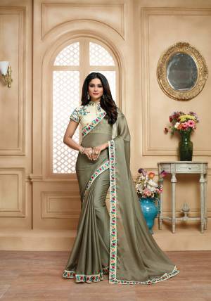 Simple And Elegant Looking Saree Is Here In Grey Color Paired With Off-White Colored Blouse. This Saree Saree IS fabricated On Chiffon Paired With art Silk Fabricated Blouse. Its Blouse And Lace Border Is Beautified With Colorful Thread Embroidery MAking The Saree Attractive. Buy Now. 
