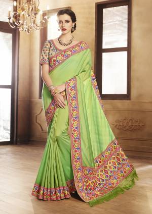 Another Attractive Designer Saree Is Here In Green Color Paired With Beige Colored Blouse. This Saree Is Fabricated On Handloom Art Silk Paired With Art Silk Fabricated Blouse. It Has Attractive Geometric Embroidered Designs.