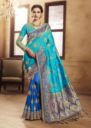 Go With The Shades Of Blue With This Shaded Saree In Blue Color Paired With blue Colored Blouse. This Saree Is Fabricated On Jacquard Silk And Handloom Art Silk Beautified With Weave And Embroidery. This Rich Designer Saree Will Leave A Great Impression Over All Onlookers.