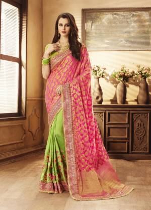 Get Ready For The Upcoming Wedding Season With This Designer Saree In Pink And Green Color Paired With Green Colored Blouse. This Saree Is Jacquard Silk and Handloom Art Silk Paired With Art Silk Fabricated Blouse. It Is Easy To Drape And Also Light In Weight To Carry Throughout The Gala.