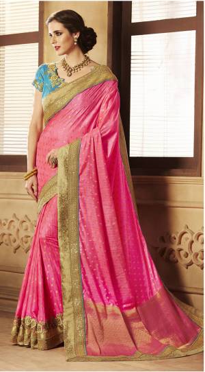 Shine Bright Wearing This Saree In Fuschia Pink Color Paired With Contrasting Turquoise Blue Colored Blouse. This Saree Is Fabricated On Jacquard Silk Paired With Art Silk Fabricated Blouse. It Is Light In Weight And Ensures Superb Comfort All Day Long.