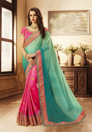 Grab This Colorful Attractive Designer Saree In Blue And Fuschia Pink Color Paired With Contrasting Fuschia Pink Colored Blouse. This Saree Is Fabricated On Crushed Georgette And Jacquard Silk Paired With Art Silk Fabricated Blouse It Is Beautified With Embroidery All Over The Blouse and Lace Border. It Is Easy To Drape And Also Easy To Carry Throughout The Gala.