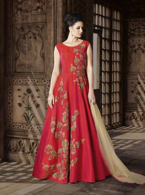 Adorn The Angelic Look Wearing This Pretty Red Colored Floor Length Suit Paired With Beige Colored Bottom And Dupatta. Its Top Is Fabricated On Art Silk Paired With Santoon Bottom And Net Dupatta. It Has Elegant Designer Embroidery Over The Gown. Buy It Now.