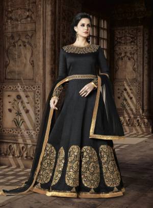 Enhance Your Beauty Wearing This Black Colored Floor Length Suit Paired With Black Colored Bottom And Dupatta. Its Top Is Fabricated On Art Silk Paired With Santoon Bottom And Net Dupatta. This Designer Suit Has Beautiful Jewelled Neckline Which Is Giving An Attractive Look. Buy This Suit Now.