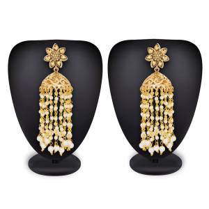 Grab This Lovely Pair Of Earrings In Golden Color With Pretty Hangings. Pair Up This Lovely Set Of Earrings With Your Traditional Attire Beautified With Stone And Pearl Work.