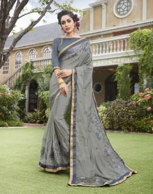 Flaunt Your Rich And Elegant Taste Wearing This Saree In Grey Color Paired With Steel Grey Colored Blouse. Thi Saree Is Fabricated On Silk Georgette Paired With Art Silk Fabricated Blouse. Wear This At The Next Formal Function At Your Place And Look The Most Amazing Of All.