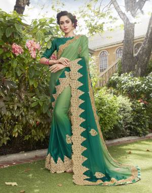 Go With The Shades Of Green With This Saree In Green And Teal Green color Paired With Teal Green Colored Blouse. This Saree Is Fabricated On Silk Georgette Paired With Art Silk Fabricated Blouse. It Has Attractive Unique Embroidery Over Its Broad Border.