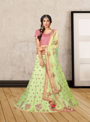 Look Pretty Wearing This Designer Lehenga In Pink Colored Blouse Paired With Contrasting Pastel Green Colored Lehenga And Dupatta. Its Lehenga And Choli Are Fabricated On Art Silk Paired With Net Dupatta. It Is Light Weight And Easy To Carry Throughout The Gala.