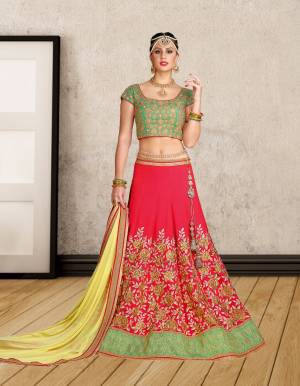 Colors add Beauty To Any Attire. So Grab This Lehnega Choli In Green Colored Blouse Paired With Contrasting Dark Pink Colored Lehenga And Yellow Colored Dupatta. Its Lehenga Choli Are Fabricated On Art Silk Paired With Chiffon Dupatta. This Ensures Superb Comfort All Day Long. Buy This Colorful Designer Lehenga Now.