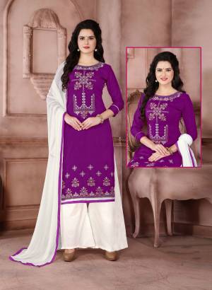 Here Is A Simple Dress Material For Your Casual wear In Purple color Paired With White Colored Bottom And Dupatta. Its Top Is Fabricated On Cambric Cotton Paired With Cotton Bottom And Chiffon Dupatta. It Has Simple Thread Embroidery Over the Top. Buy It Now. 