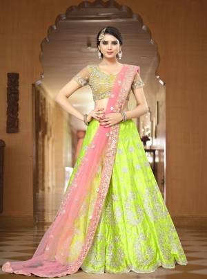 This Season Is About Subtle Shades And Pastel Play, So Grab This Designer Lehenga Choli In All Pastel Shades With Yellow Colored Blouse Paired With Green Colored Lehenga And Pink Colored dupatta. All Three Shades Compiments Each Other So Beautifully Which Will Earn You Lots Of Compliments From Onlookers.