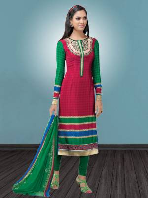 Here Is A Simple Suit For your Casual wear In Dark Pink color Paired With Contrasting Green Colored bottom And dupatta. Its Top And Bottom Are Fabricated On Crepe Paired With Chiffon Dupatta. Buy This Semi-Stitched Suit Now.