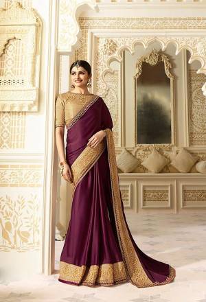 Add This Very Pretty Saree To Your Wardrobe In Wine Color Paired With Beige Colored Blouse. This Saree Is Fabricated On Silk Paired With Art Silk Fabricated Blouse. It Has Embroidered Lace Border And Embroidered Blouse. Buy This Saree Now.