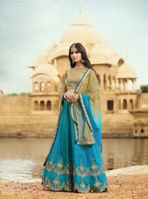 Celebrate This Festive Season With Beauty And Comfort Wearing this Designer Lehenga Choli. Its Blouse Is In Beige Color Paired With Blue Colored Lehenga And Beige And Blue Shaded Dupatta. Its Blouse Is Fabricated On Tissue Paired With Art Silk Lehenga And Net Dupatta. It Is Light In Weight And Easy To carry All Day Long.