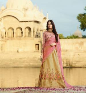Look Pretty Wearing This Designer Lehenga Choli In Beautiful Pink Colored Blouse Paired With Beige Colored Lehenga And Pink Colored Dupatta. Its Lehenga And Choli Are Fabricated On Art Silk Paired With Net Fabricated Dupatta. All Three Fabrics Ensures Superb Comfort All Day Long. Buy It Now.