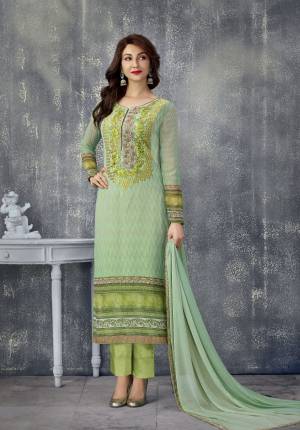 Grab This Straight Cut Suit For Your Festive Wear In Light Green Colored top Paired With Green Colored Bottom And Light Green Colored Dupatta. Its Top Is Fabricated On Georgette Paired With Santoon Bottom And Chiffon Dupatta. It Is Beautified With Digital Prints And Thread Embroidery. buy Now.