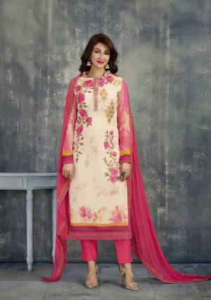 Here Is A Pretty Elegant suit In Cream Color Paired With Dark Pink Colored Bottom And Dupatta. Its Top Is Fabricated On Georgette Paired With Santoon Bottom And Chiffon Dupatta. It Is Beautified With Digital Prints And Resham Embroidery Over Its Top.