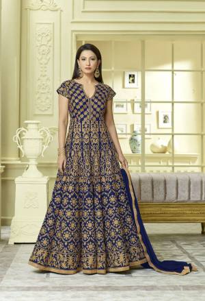 Shine Bright Wearing This Royal Blue Colored Floor Length Designer Suit Paired With Royal Blue Colored Bottom and dupatta. Its Top IS Fabricated On Art Silk Paired With Santoon Bottom And Chiffon Dupatta. IT Has Heavy Embroidery All Over The Top. Buy Now.