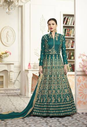 New And Unique Shade Of Blue Is Here With This Designer Floor Length Suit In Teal Blue Color Paired With Teal Blue Colored Bottom And Dupatta. Its Top IS Fabricated On Art Silk Paired With Santoon Bottom And Chiffon. Its Fabrics Ensures Superb Comfort All day Long.