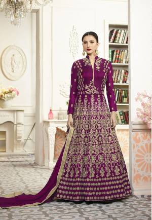Bright And Visually Appealing Dress Is Here With This Heavy Designer Floor Length Suit In Magenta Pink Color Paired With Magenta Pink Colored Bottom And Dupatta. Its Top Is Fabricated On Art Silk Paired With Santoon Bottom And Chiffon Dupatta. This Lovely Suit Enures Superb Comfort And Earn You Lots Of Compliments From Onlookers.