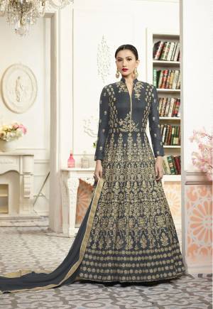 Flaunt Your Rich And Elegant Taste Wearing This Heavy Floor Length Designer Suit In Grey Color Paired With Grey Colored Bottom And Dupatta. Its Top Is Fabricated On Art Silk Paired With Santoon Bottom And Chiffon Dupatta. This Designer Suit Is Light Weight And Easy To Carry All Day Long. Buy It Now.
