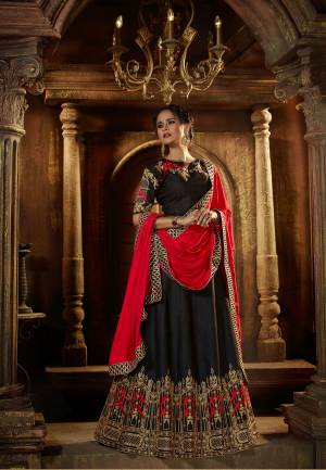 Enhance Your Beauty Wearing This Black Colored Lehenga Choli Paired With Red Colored Dupatta. This Lehenga Choli Is Fabricated On Art Silk Paired With Satin Fabricated Dupatta. It Is Beautified With Attractive Embroidery Over The Blouse And Lehenga. Buy This Designer Lehenga Choli Now.