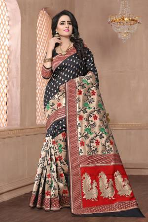 Enhnace Your Beauty And Personality Wearing This Saree In Black Color Paired With Black Colored Blouse. This Saree And Blouse Are Fabricated On Banarasi Art Silk Beautified With Weave All Over It. Its Rich Fabric Will Give A Great Look To Your Personality.