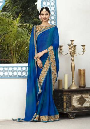 Grab This Beautiful Designer Saree In Blue Color Paired With Beige Colored Blouse. This Saree Is Fabricated On Georgette Paired With Art Silk Fabricated Blouse. It Is Beautified With Embroidery Over The Blouse And Saree Lace Border.