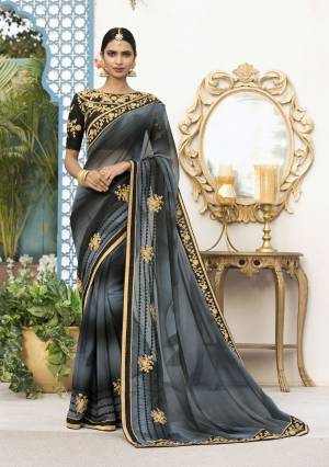 Enhance Your Beauty Wearing This Designer Saree In Grey And Black Color Paired With Black Colored Blouse. This Saree Is Fabricated On Georgette Paired With Art Silk Fabricated Blouse. It Has Embroidery Over The Blouse And Saree Which Is Giving More Pretty Look To The Saree Is Fabricated On Georgette Paired With Art Silk Fabricated Blouse. It Is Light In Weight And Easy To Drape. Buy Now.