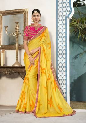 Yellow Color Induces Perfect Summery Appeal To Any Outfit, So Grab This Saree In Yellow Color Paired With Contrasting Fuschia Pink Colored Blouse. This Saree Is Fabricated On Chiffon Paired With Art Silk Fabricated Blouse. Its Attractive Colors And Embroidery Will Earn You Lots Of Compliments From Onlookers.