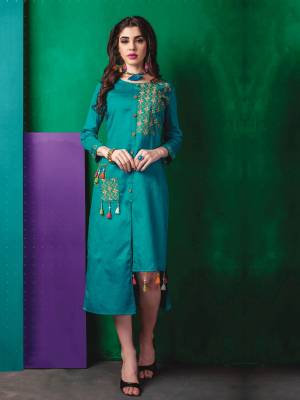 For A Very Pretty Look Grab This Beautiful Kurti In Turquoise Blue Color Fabricated On Cotton. This Kurti Is Beautified With Multi Colored Thread Work. Buy This Kurti Now.