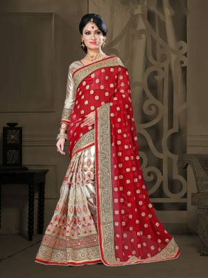 Grab This Rich Looking Saree In Red And White Color Paired With Golden Colored Blouse. This Saree Is Fabricated On Georgette And Net Paired With Paired With Gota Fabricated Blouse. It Is Light Weight And Easy To Carry All Day Long.