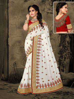 Be A Festival, Wedding Or .Any Foraml Fucntion, Grab This Pretty White Colored Saree Paired With Maroon Colored Blouse. This Saree Is Fabricated On Georgette Paired With Art Silk Fabricated Blouse. It Is Light In Weight And Easy To Carry All Day Long
