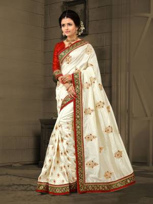 Earn Lots Of Compliments Wearing This Proper Traditonal Saree In Off-White Color Paired With Red Colored Blouse. This Saree Is Fabricated On Soft Art Silk Paired With Art Silk fabricated Blouse. It Is Beautified With Detailed Embroidery All Over The Saree.